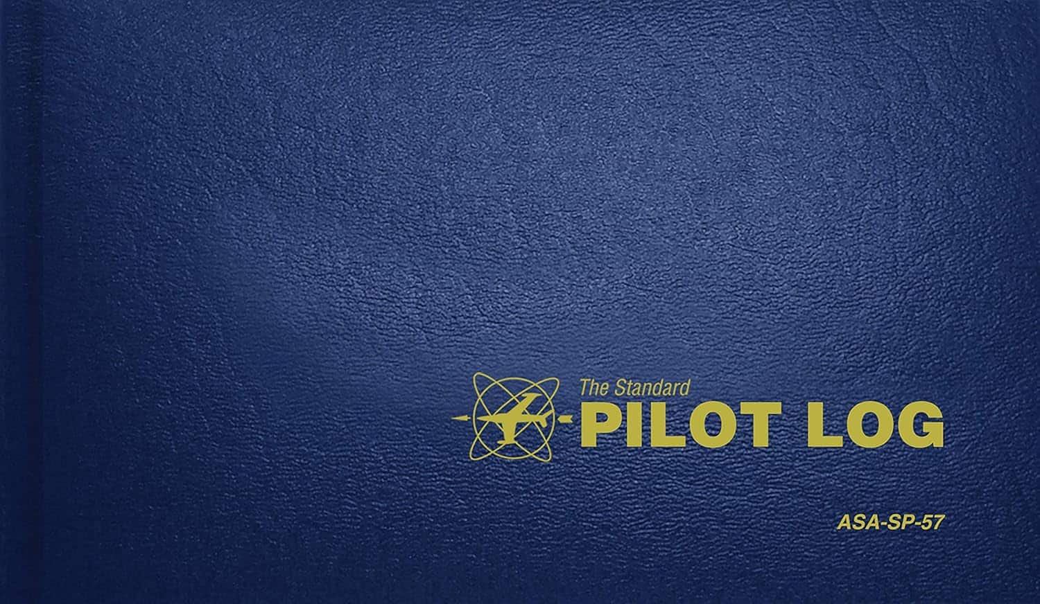 Cover of a pilot log book titled "The Standard Pilot Log" with a blue textured background.