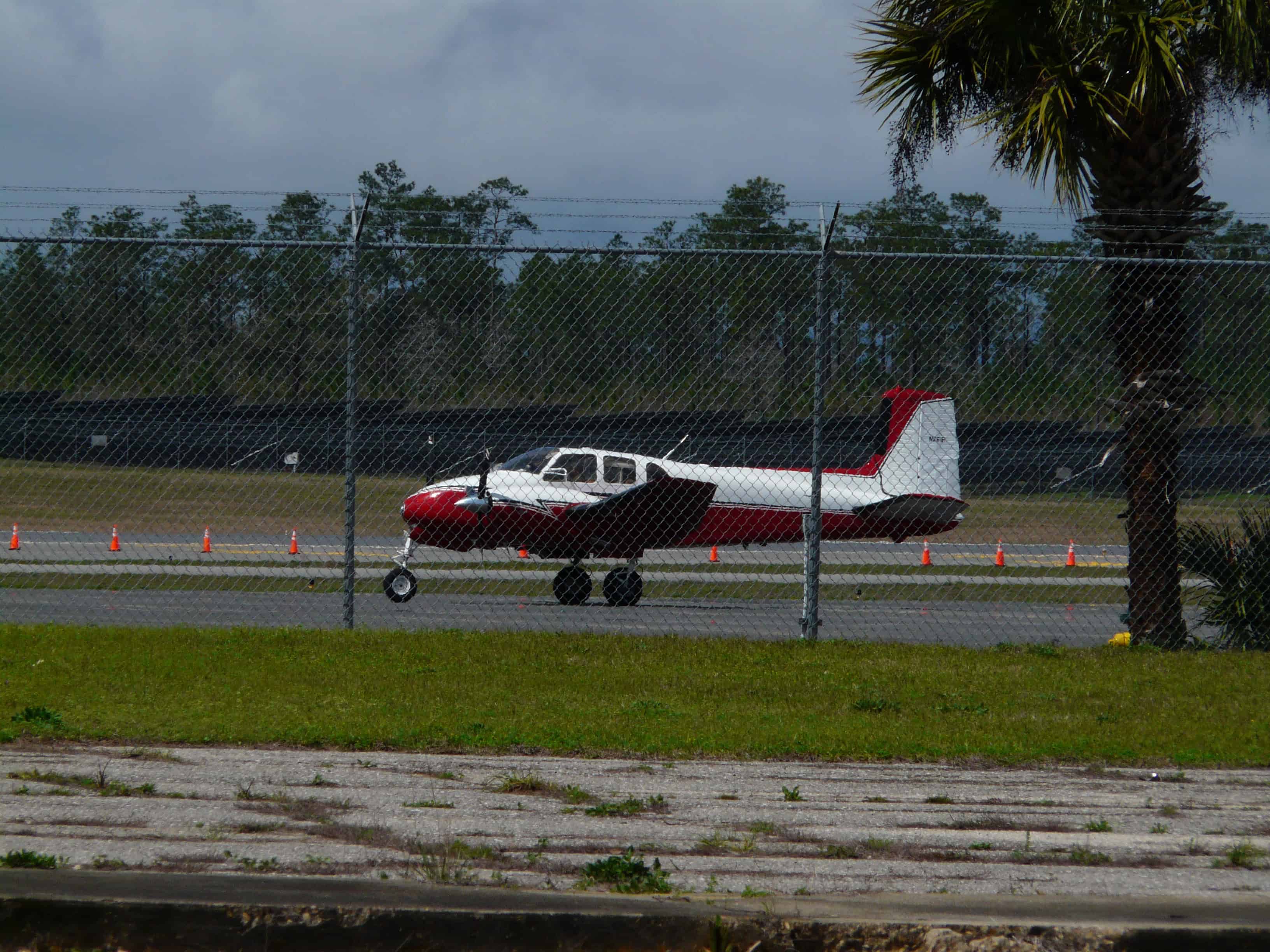 Beechcraft Bonanza aircraft on airport ramp before a cross-country flight