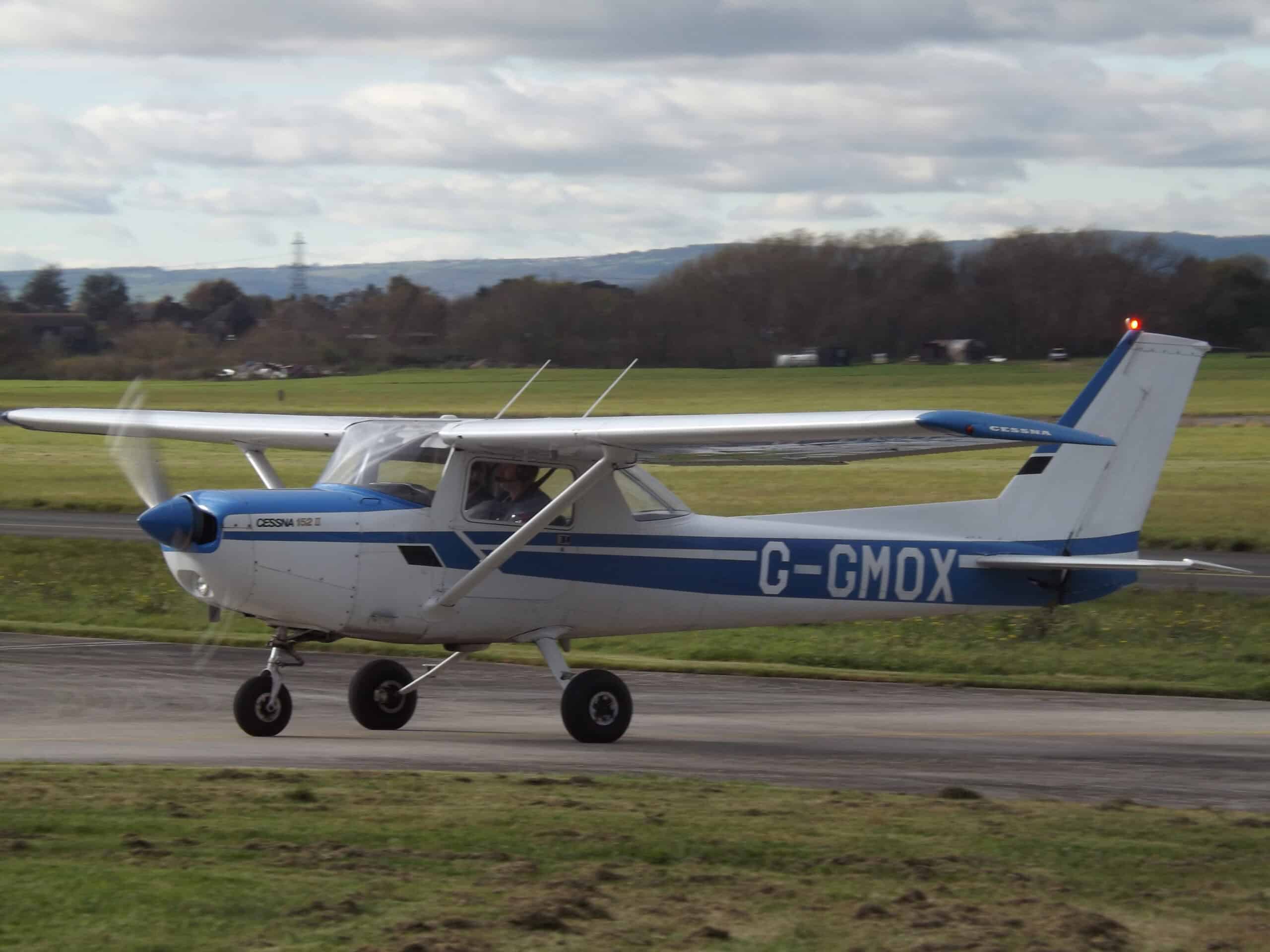 Pilot and examiner post-flight debrief at FBO after checkride