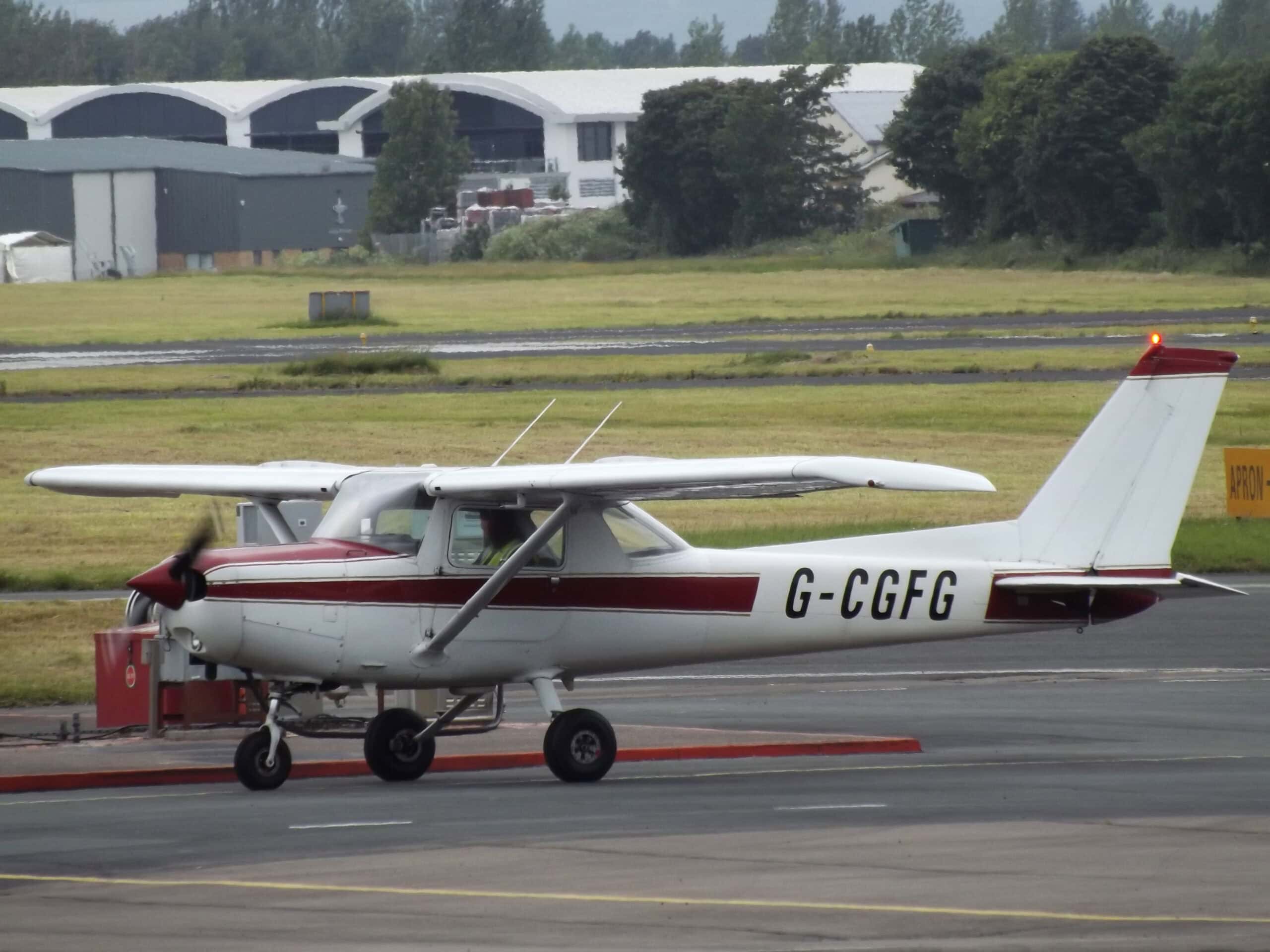 Cessna 152 at flying club small airport hangar