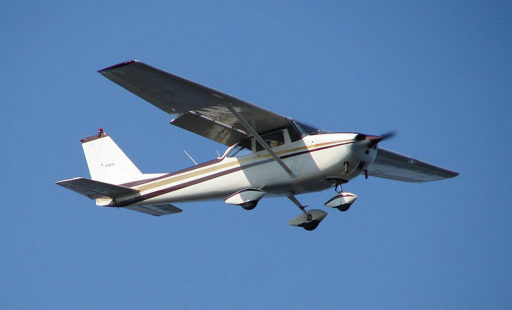 small plane on short final approach to runway