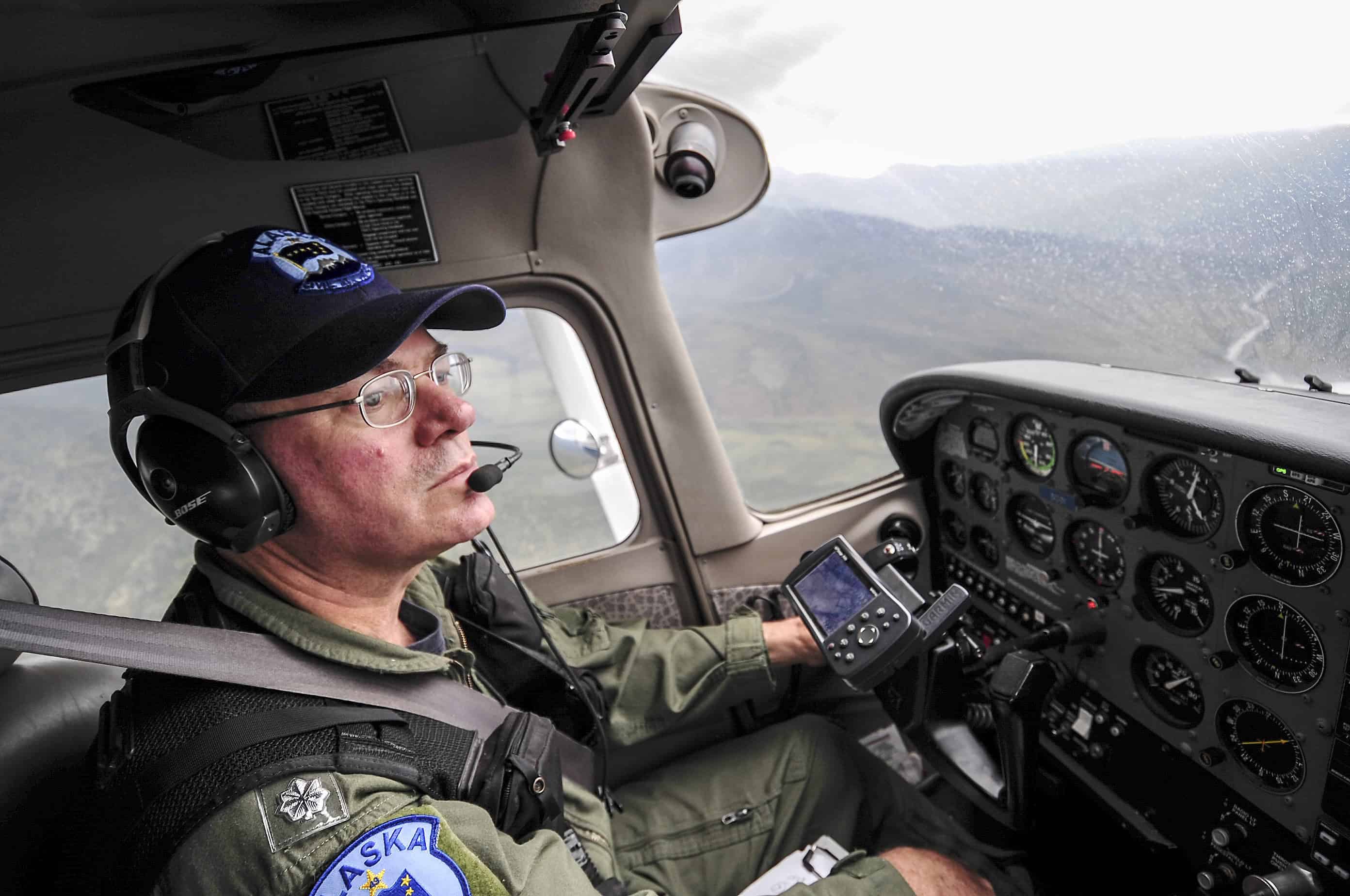 cessna 172 pilot learning how to read a sectional chart in cockpit