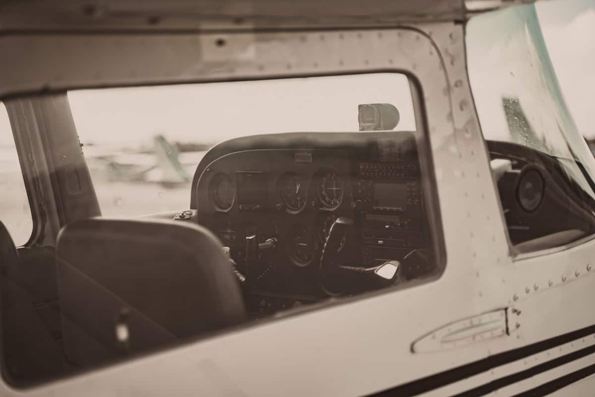 Cessna cockpit with pilot flying through controlled airspace with avionics panel