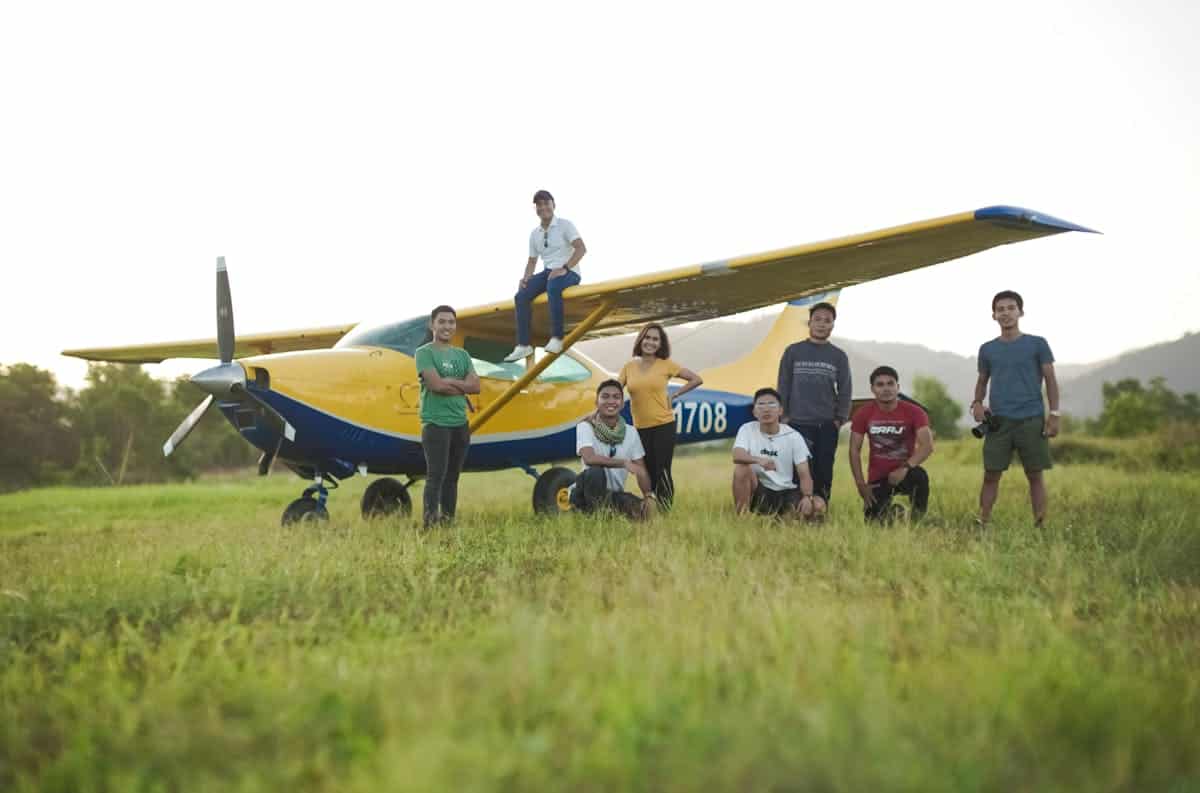 GA pilot health — pilots standing by a Cessna 182 on a sunny airfield