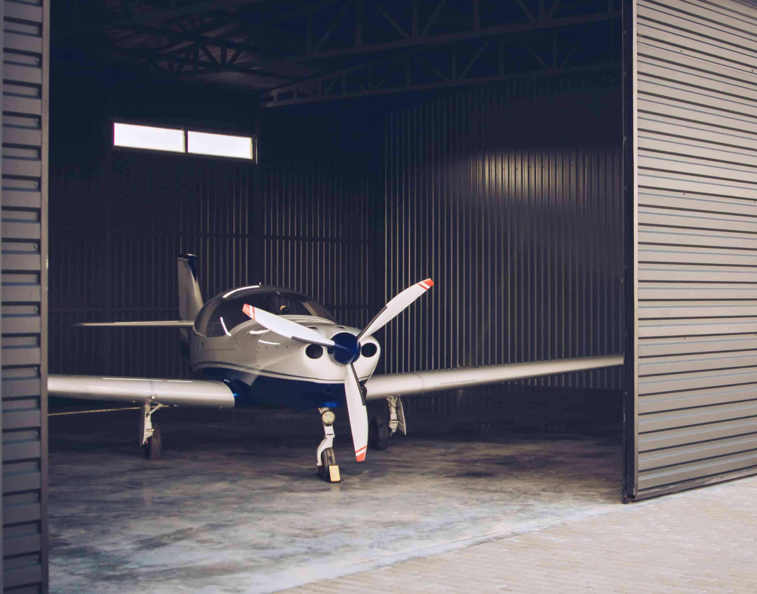 Small private aircraft in a clean hangar