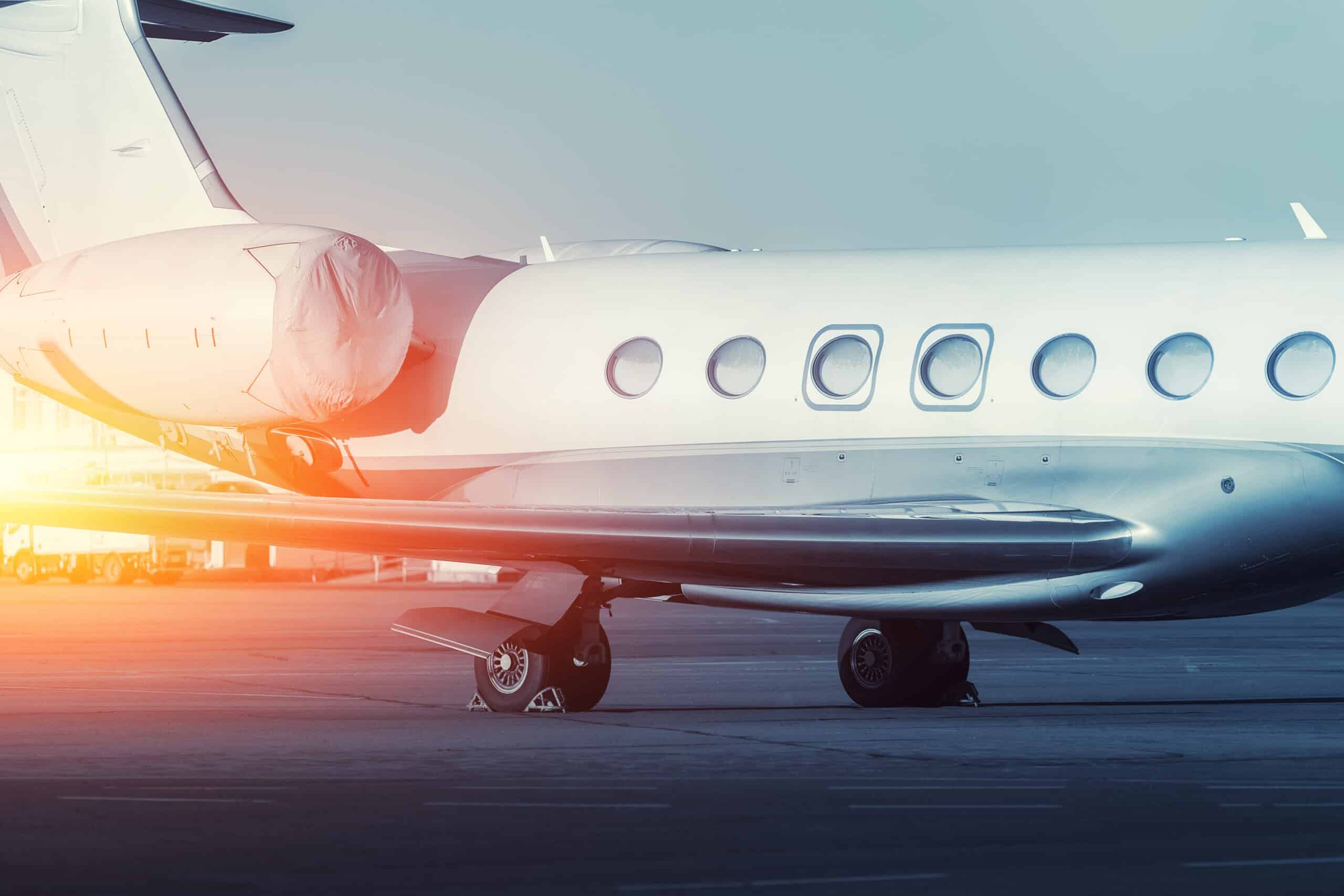 Private aircraft at an airport at sunset
