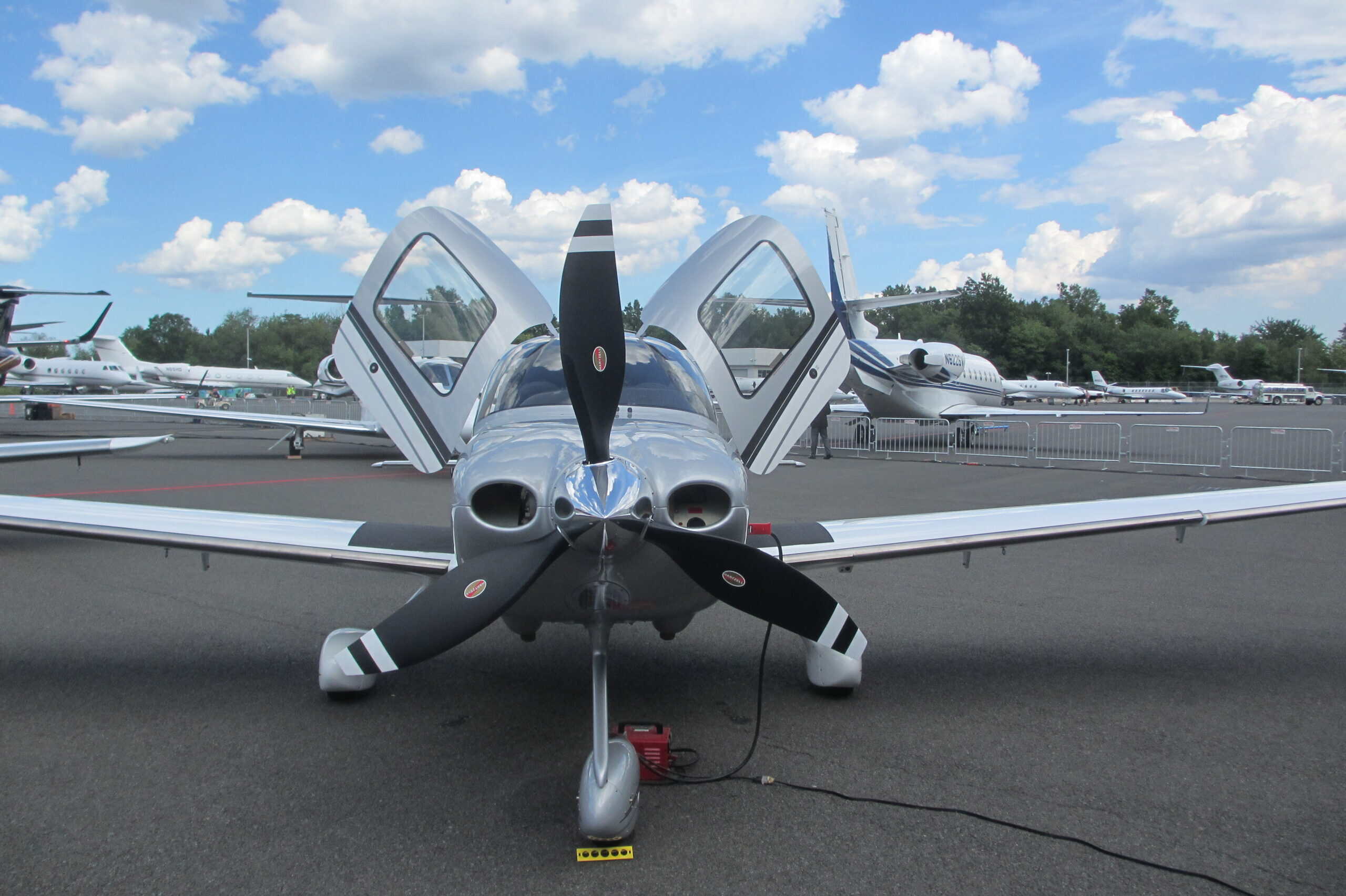 Cirrus SR22 on the ramp — the distinctive low-wing composite design that redefined GA safety