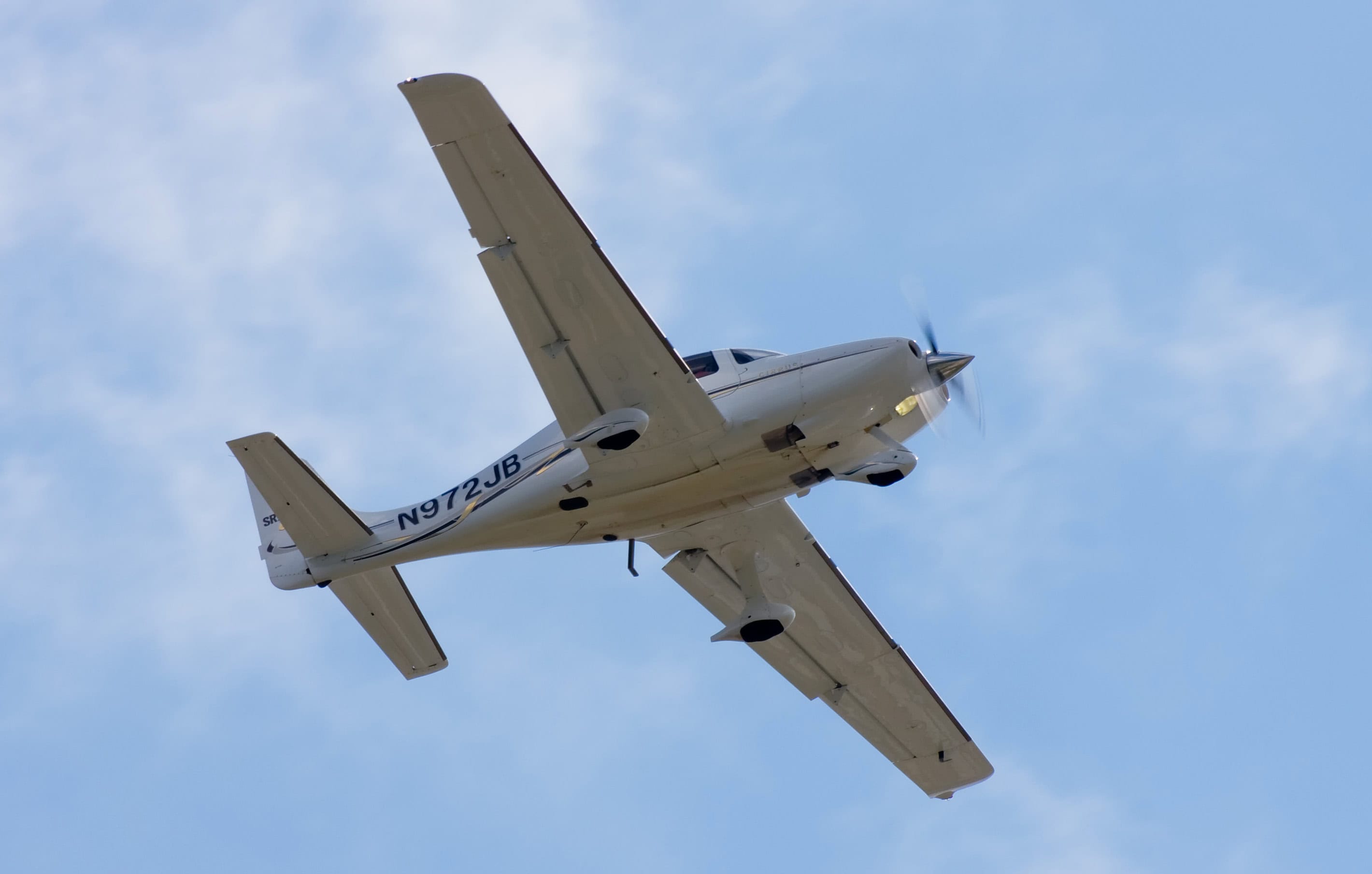 Cirrus SR22 in flight showing distinctive low-wing planform