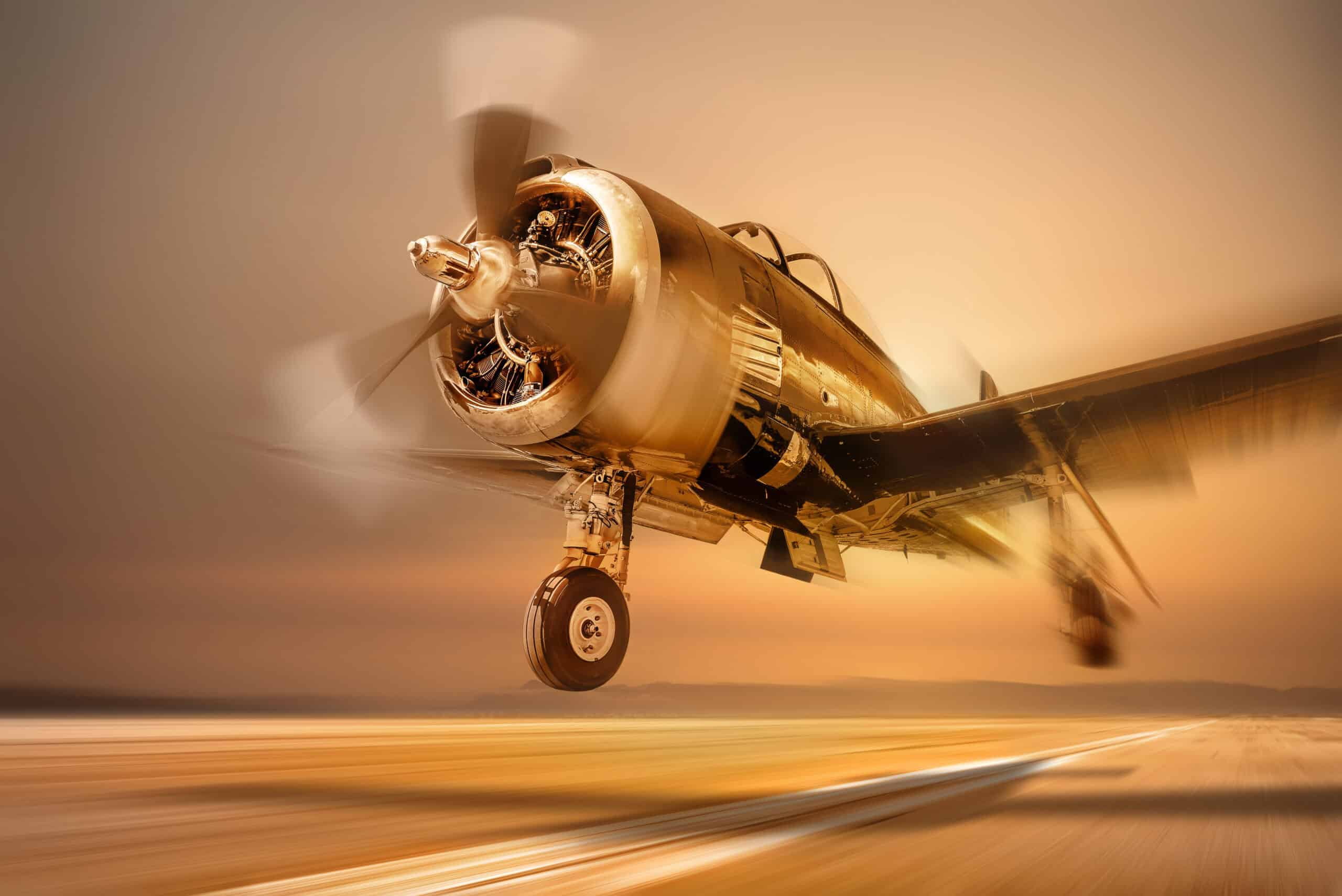 Vintage propeller aircraft taking off at sunset with motion blur.