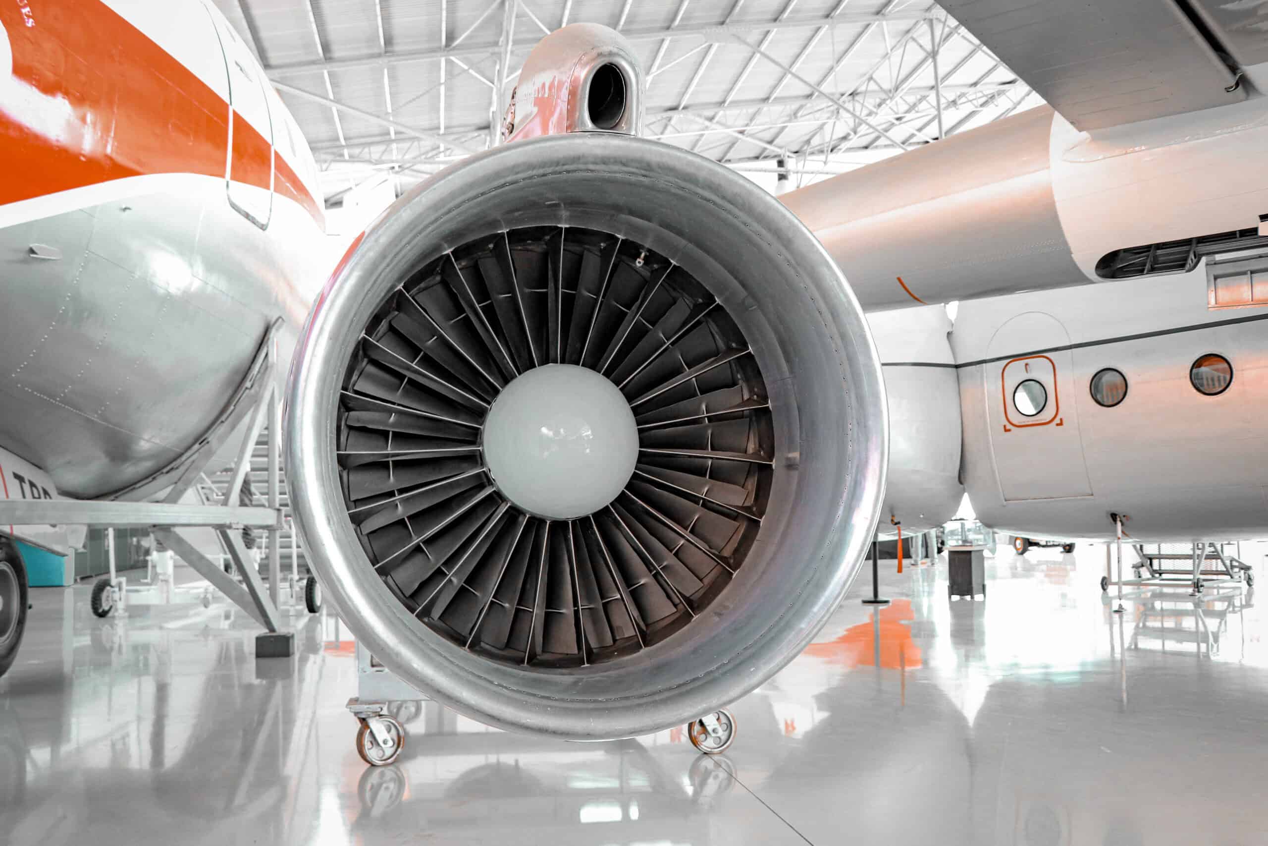 Commercial jet engine on display at an aviation museum.