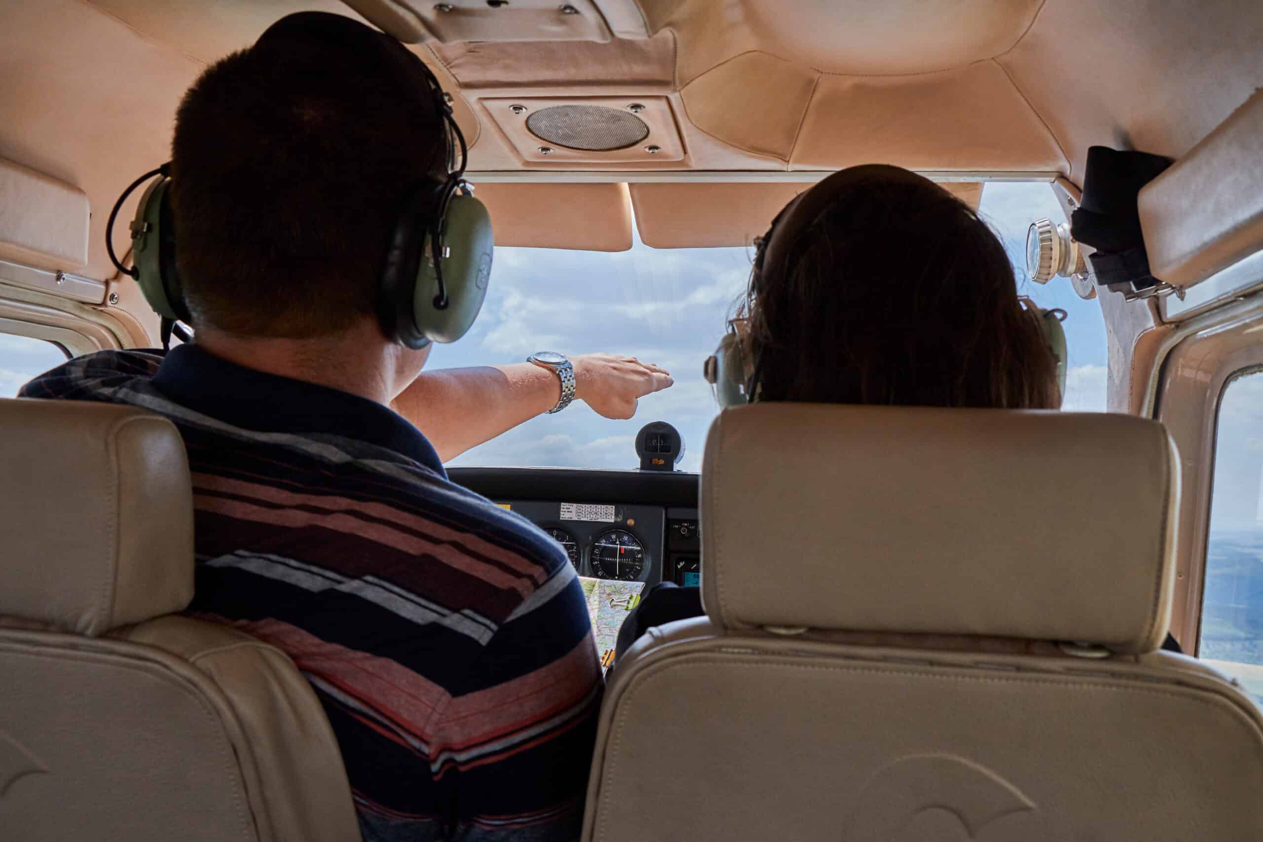 Flight instructor and student pilot in Cessna 172 cockpit training the next generation of pilots