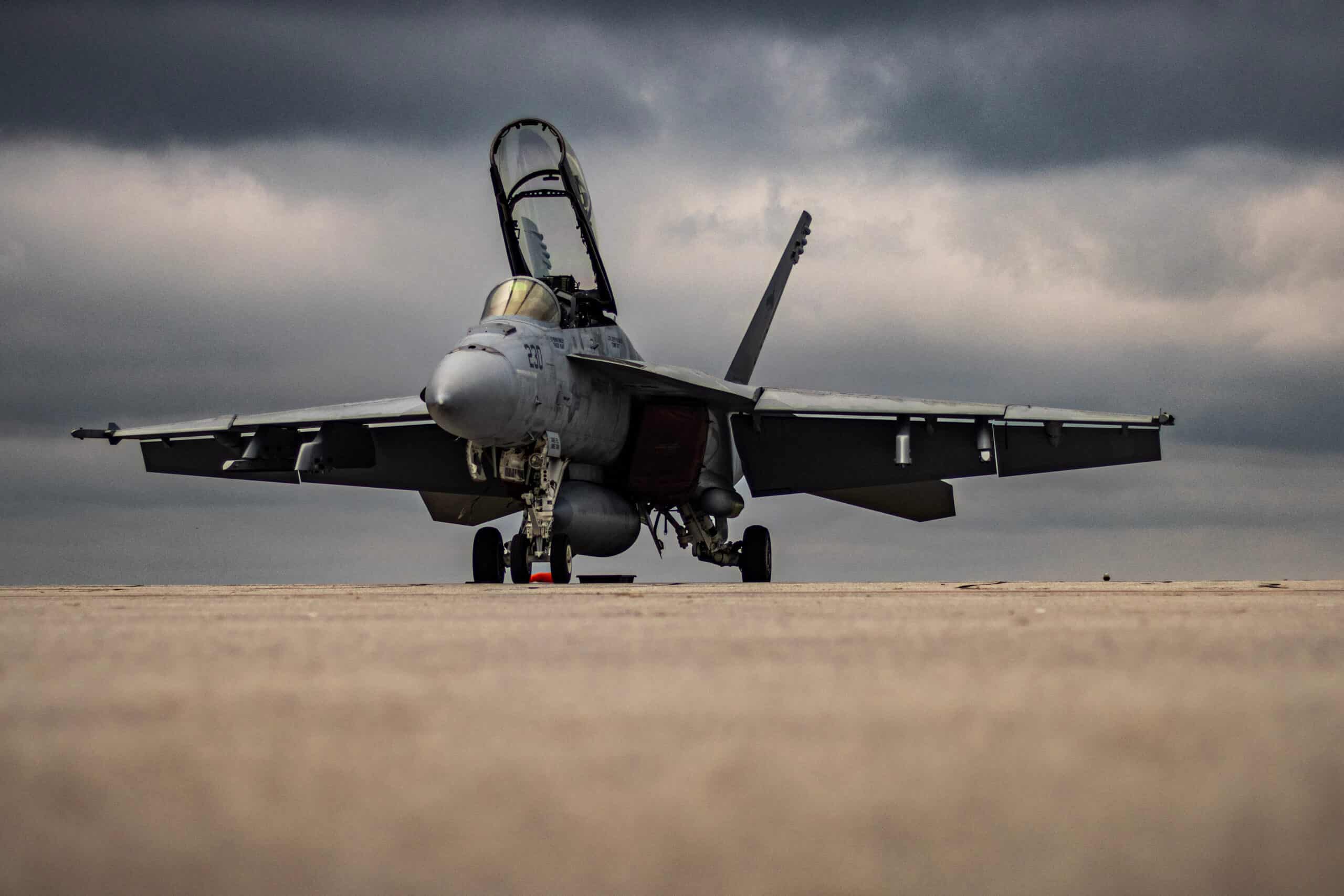 Military fighter jet on tarmac displaying the design lines of Cold War-era aircraft engineering