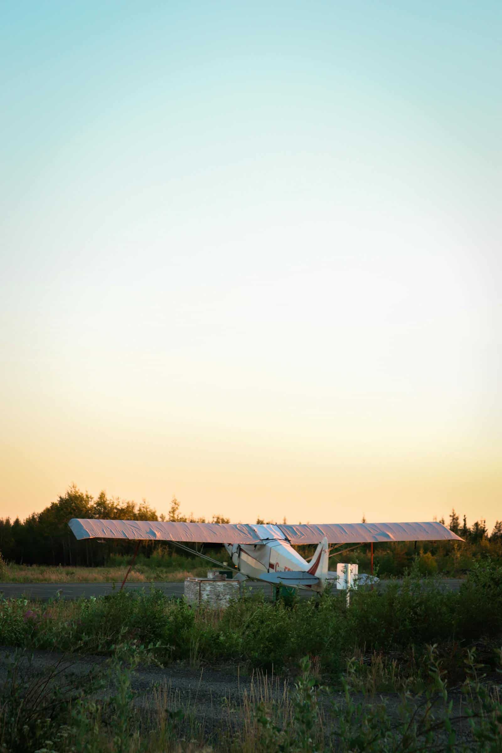 Light experimental aircraft on a remote airstrip