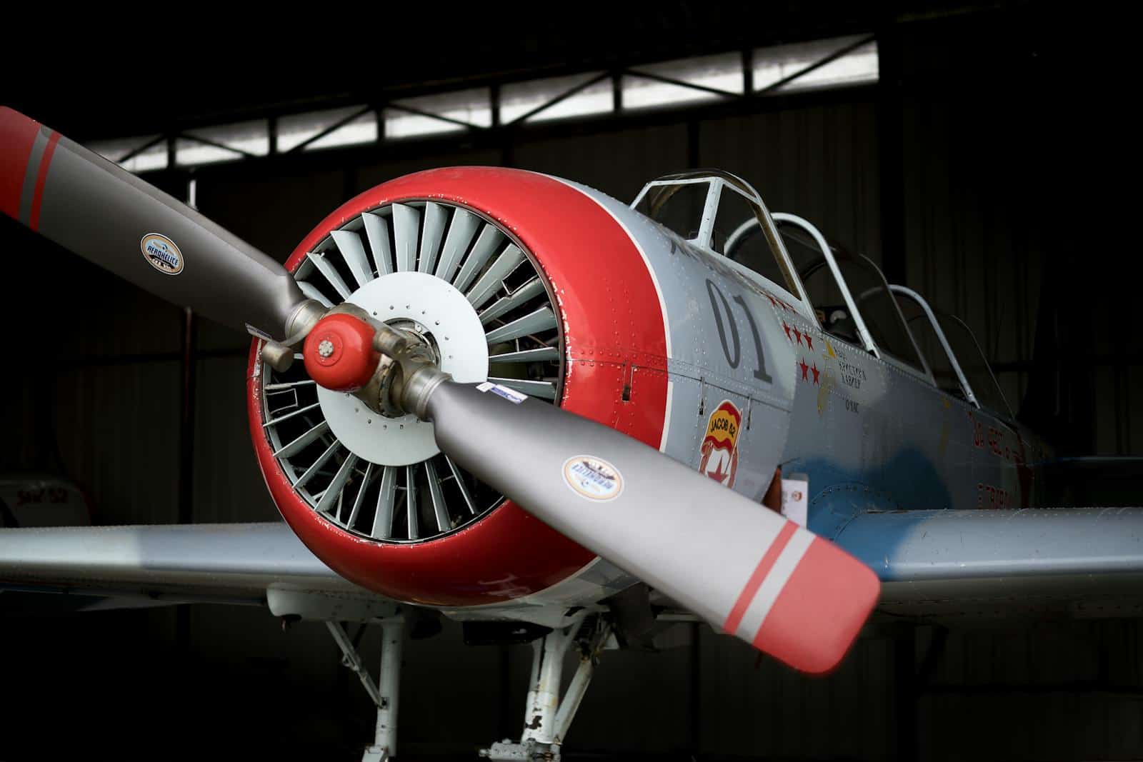 Vintage aircraft displayed inside a hangar
