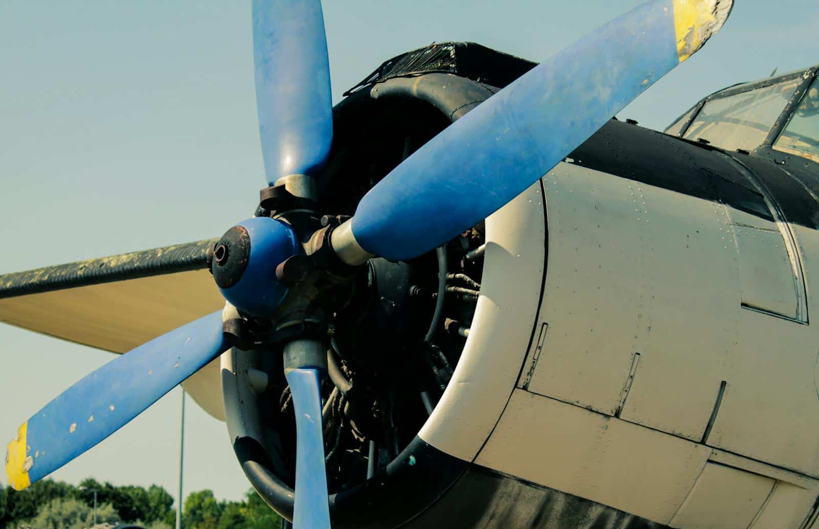Detailed view of a vintage aircraft propeller with blue blades