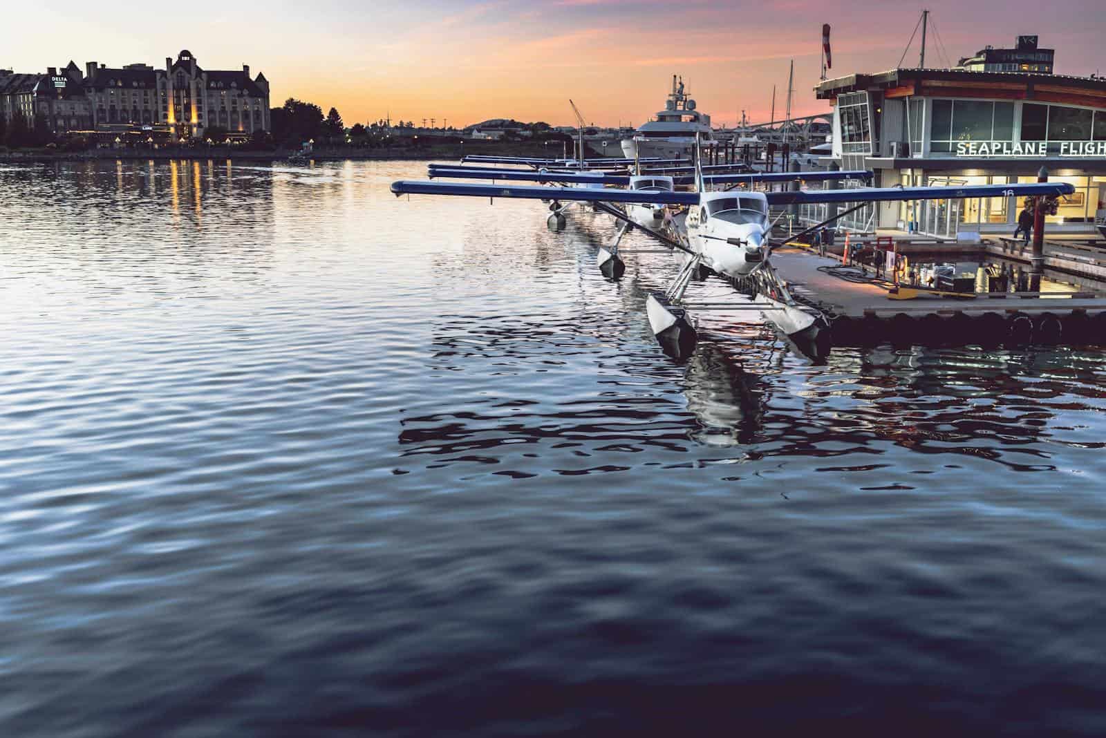 Seaplane moored at a harbor at sunset