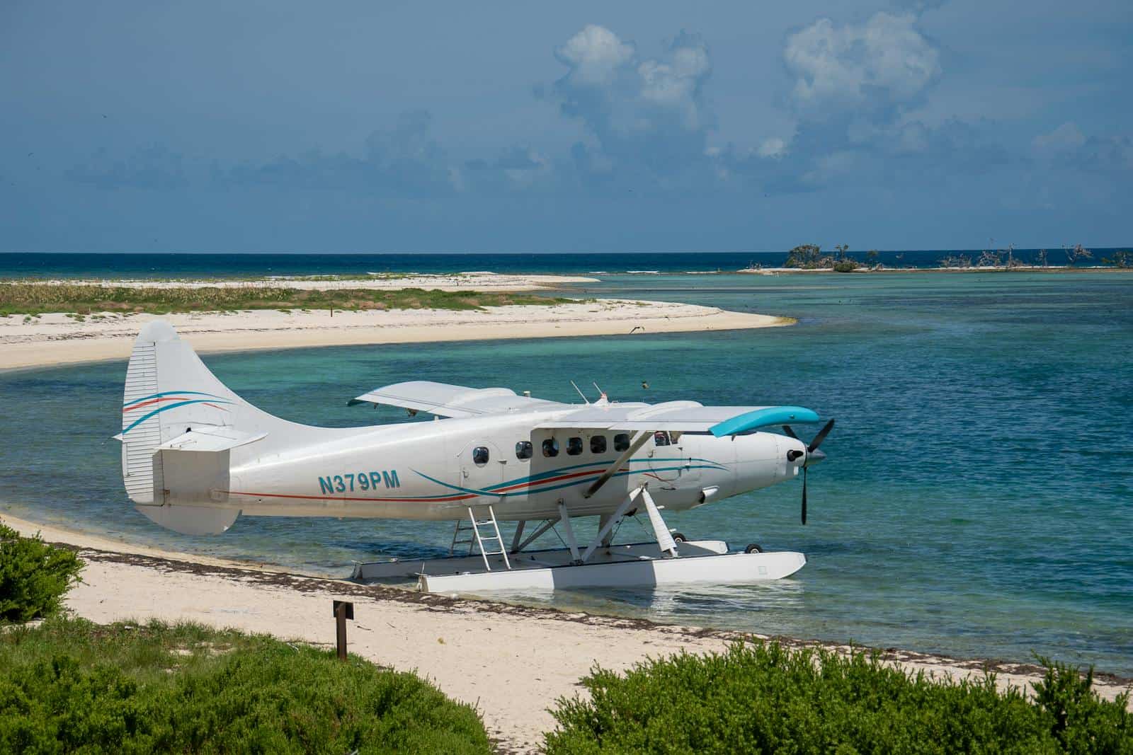Floatplane resting on a sandy beach