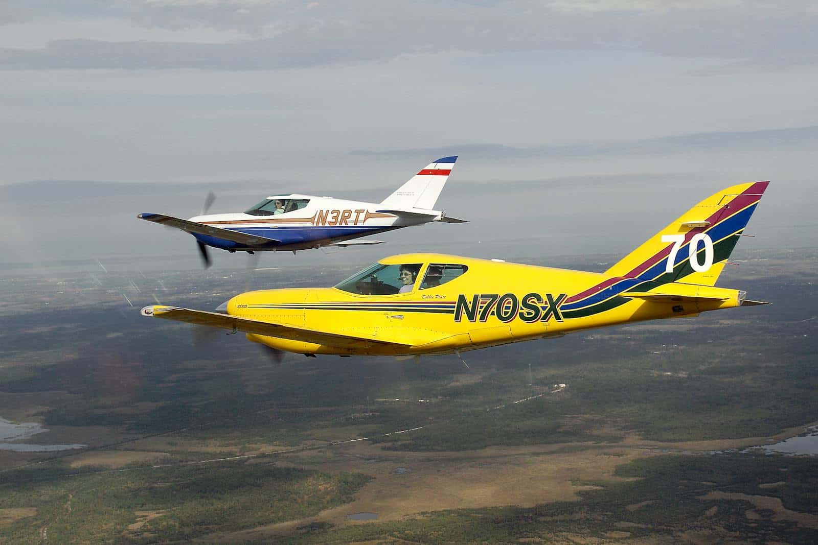 Aerial view of two general aviation aircraft flying in formation