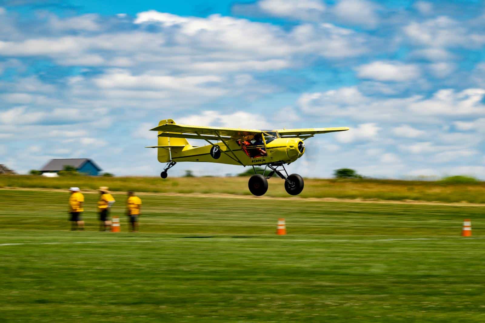 Light aircraft on a grass runway at a small airfield