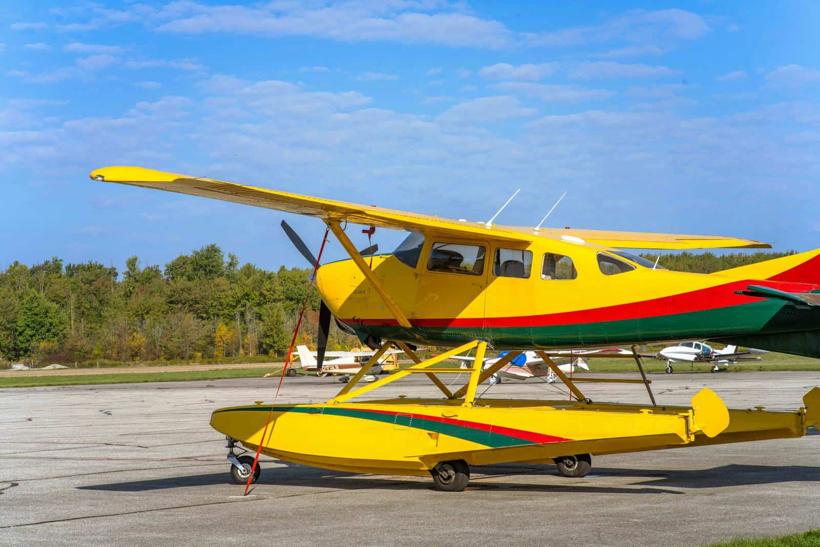 Yellow GA aircraft staged outdoors under blue sky