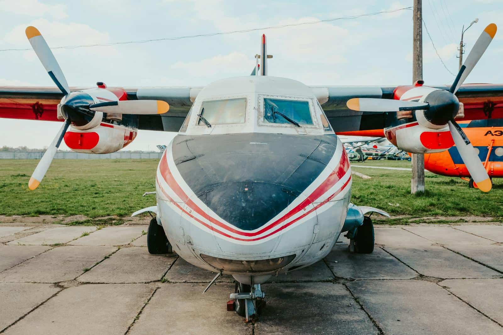 Turboprop aircraft parked outdoors on a sunny day