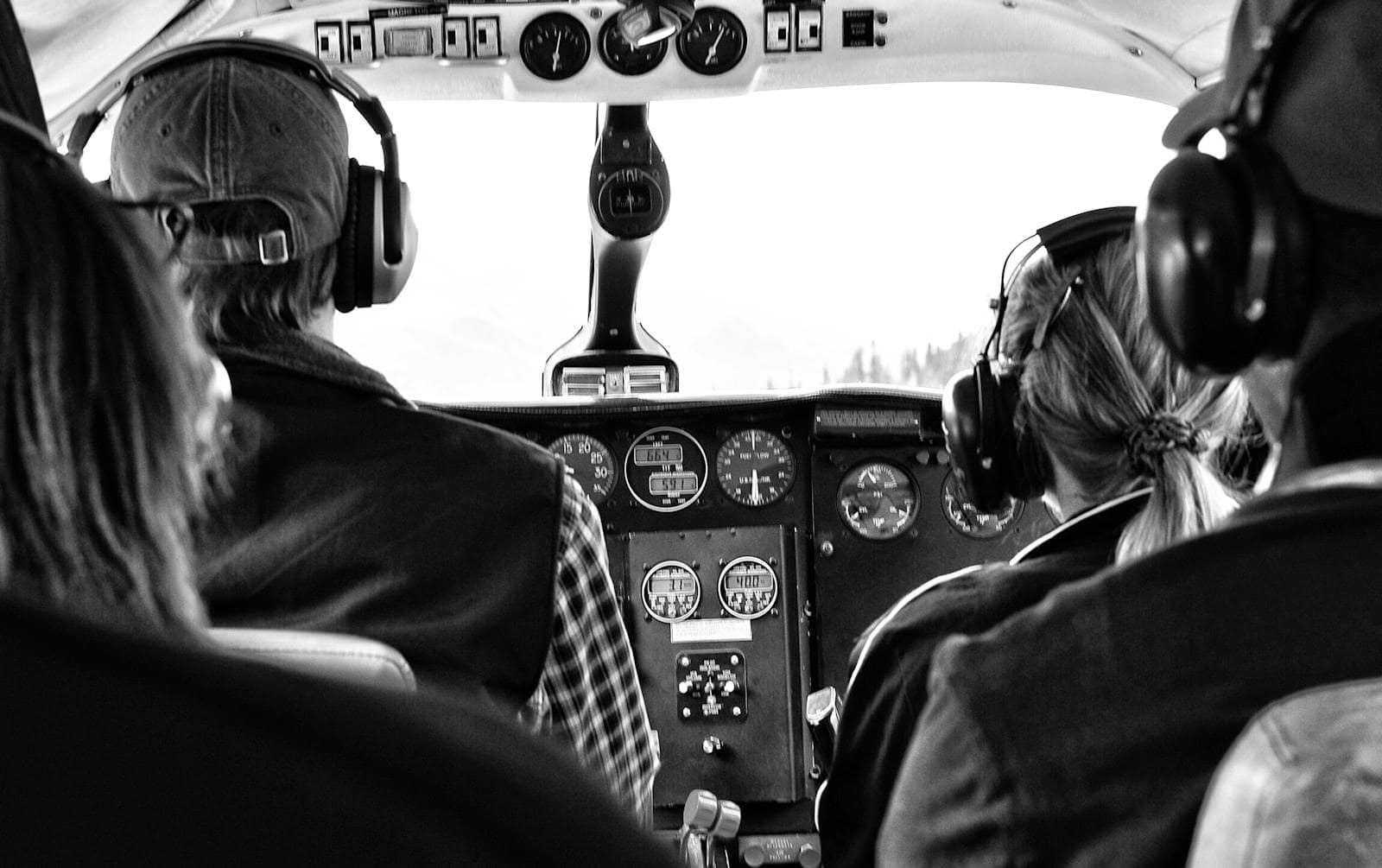 Two pilots inside a general aviation aircraft cockpit