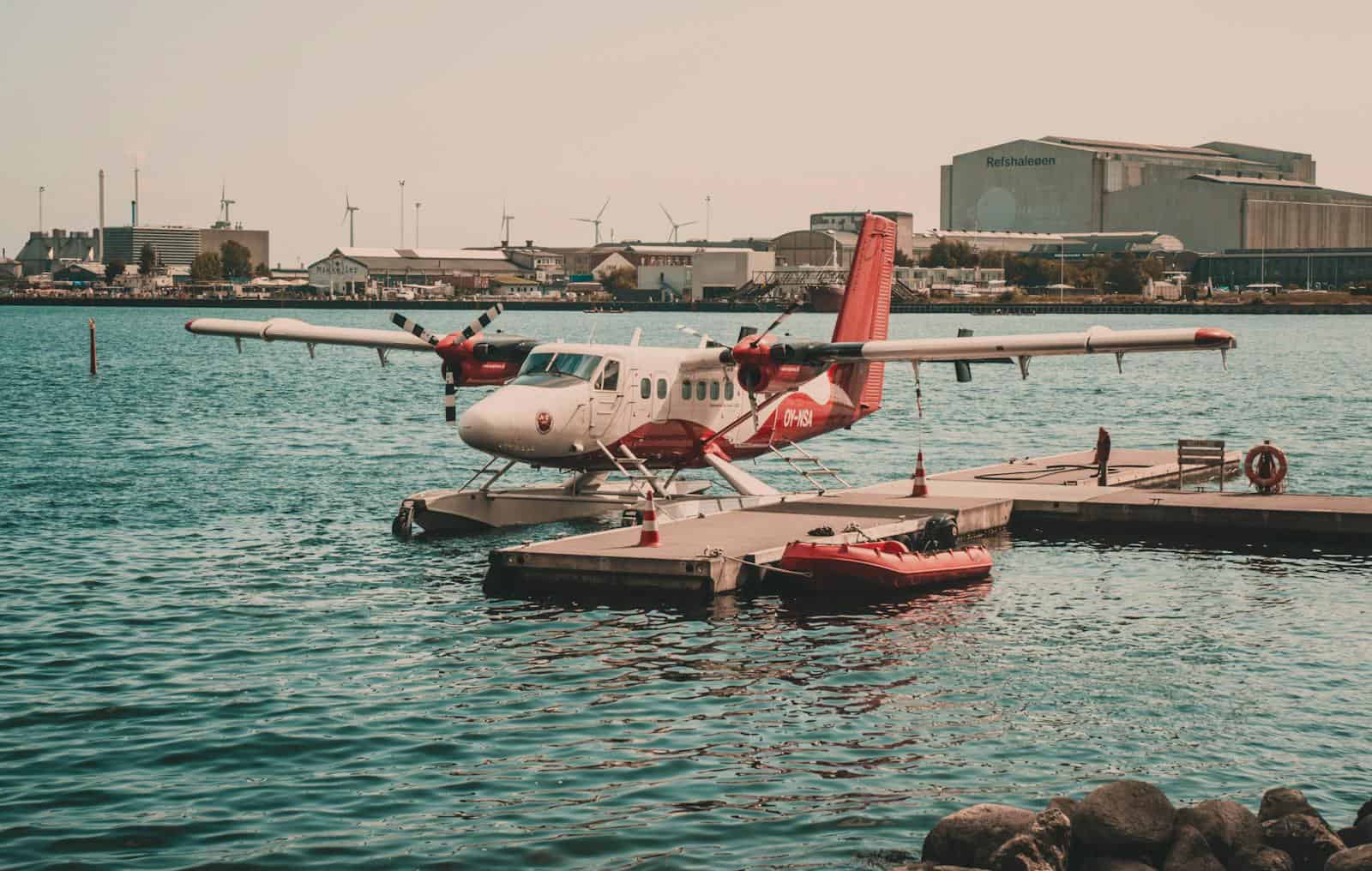 Seaplane docked at a working harbor