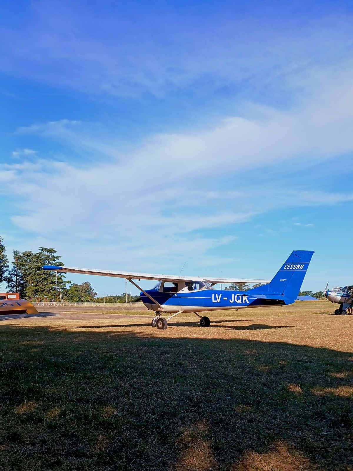 Blue Cessna airplane at rural airfield illustrating Cessna 210 Centurion ownership lifestyle