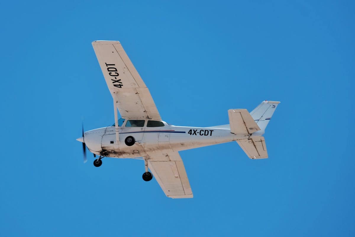 Vintage propeller airplane against blue sky