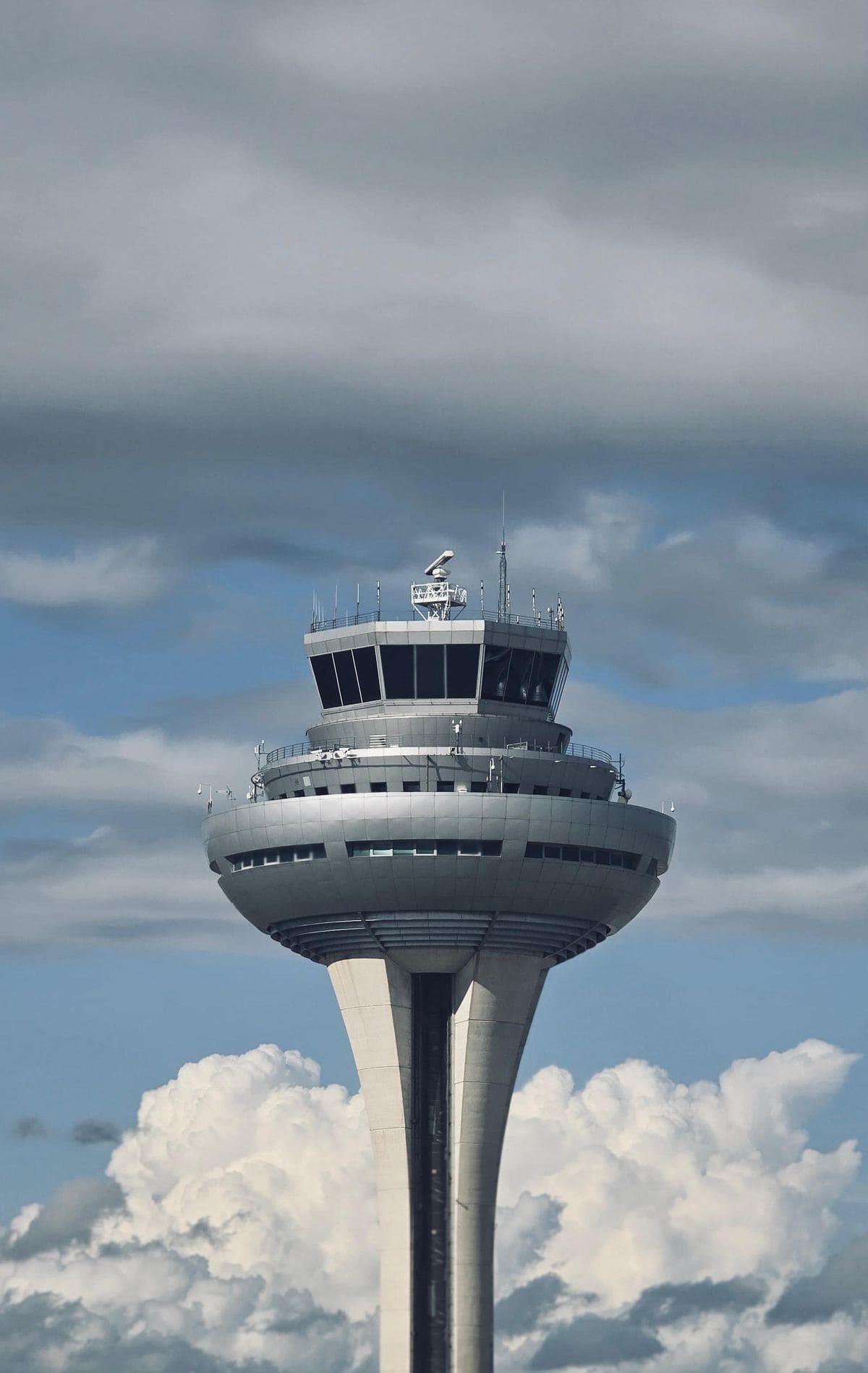 Air traffic control tower with observation deck and radar equipment.