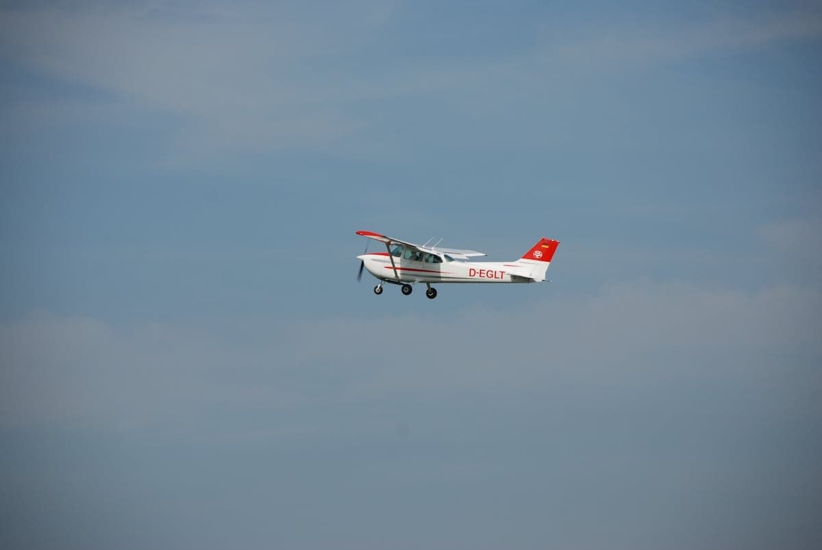 Small aircraft in flight against a clear blue sky