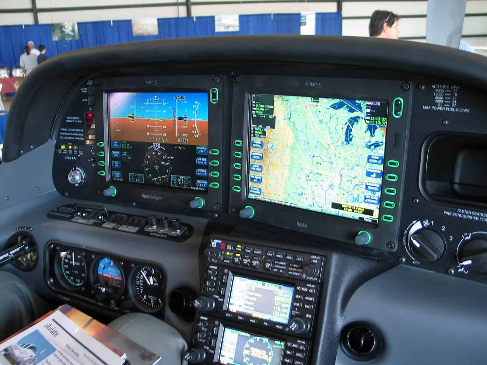 Modern aircraft cockpit with advanced navigation and flight instruments.