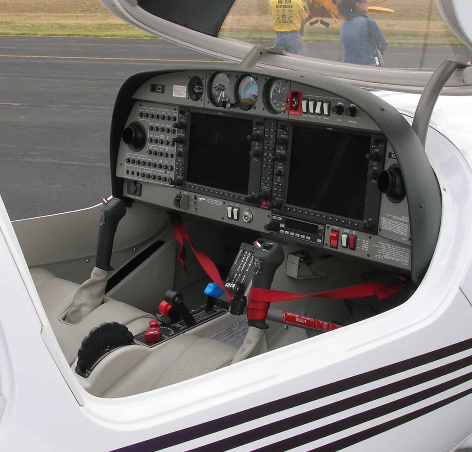 Close-up of a modern general aviation aircraft cockpit with instruments and controls.