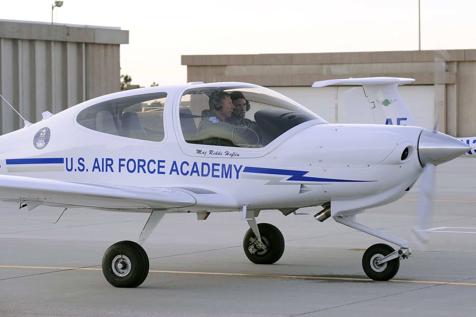 Diamond T-52A — the U.S. Air Force Academy training variant of the Diamond DA40 — with instructor and student on the ramp