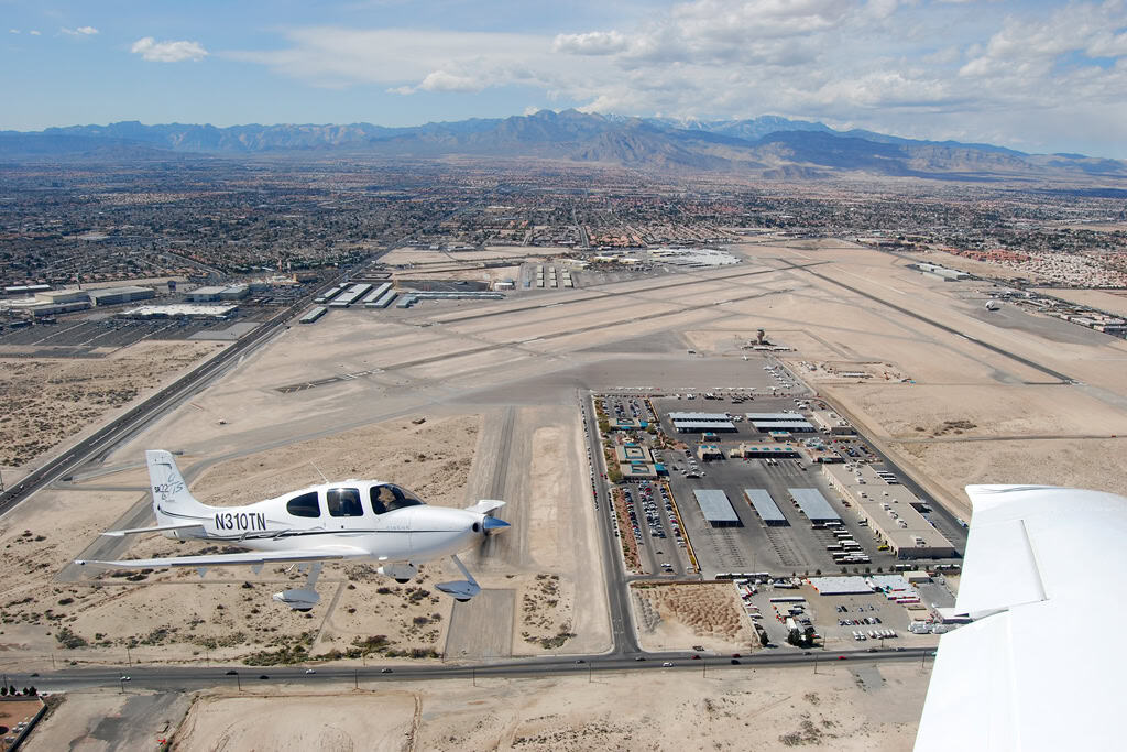 Cirrus SR22 on final approach in marginal weather — reading PIREPs shapes the go/no-go call on flights like this.