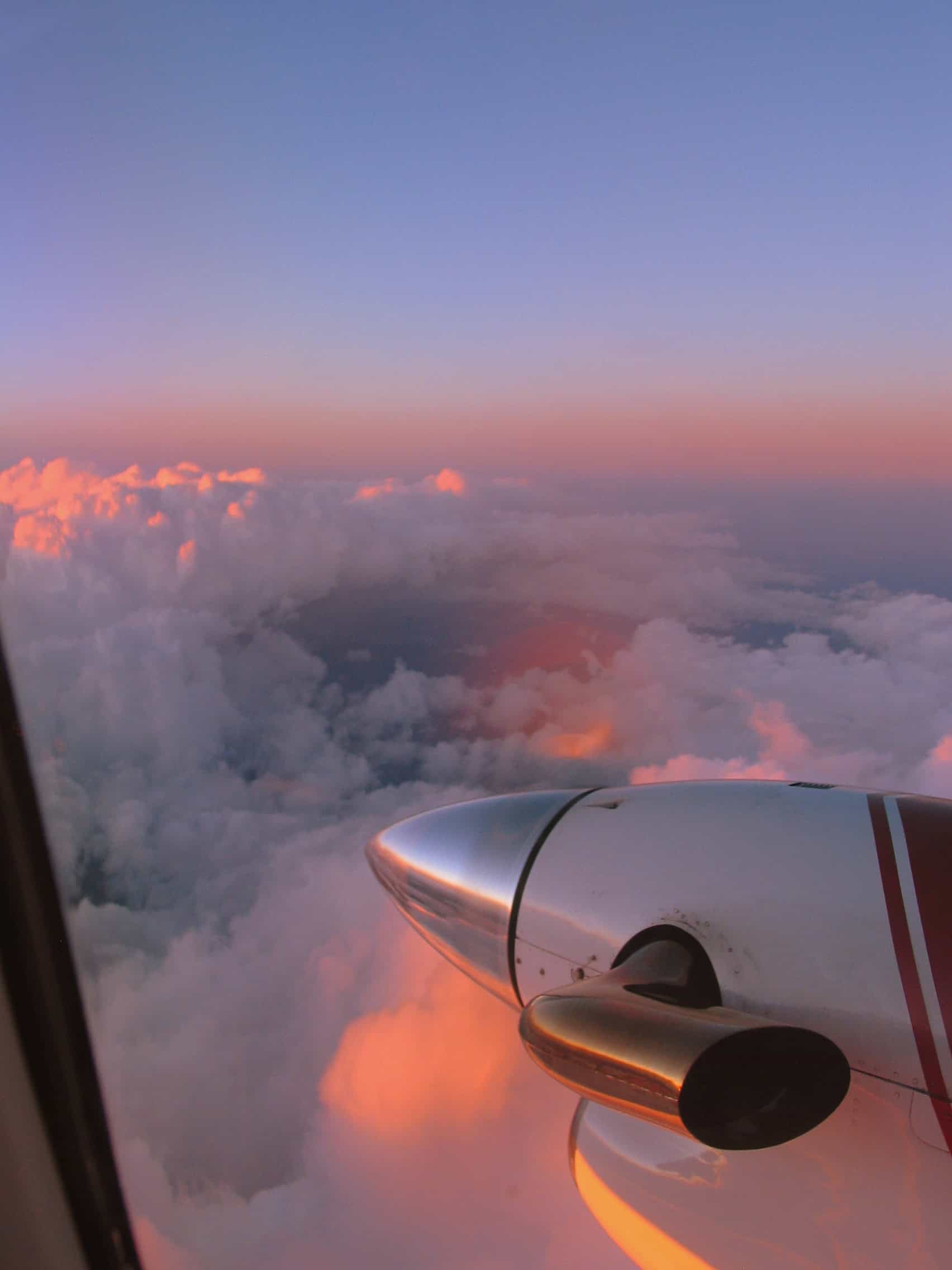 Lines of scattered cumulus from a GA cockpit — the cloud picture reading PIREPs teaches you to correlate.