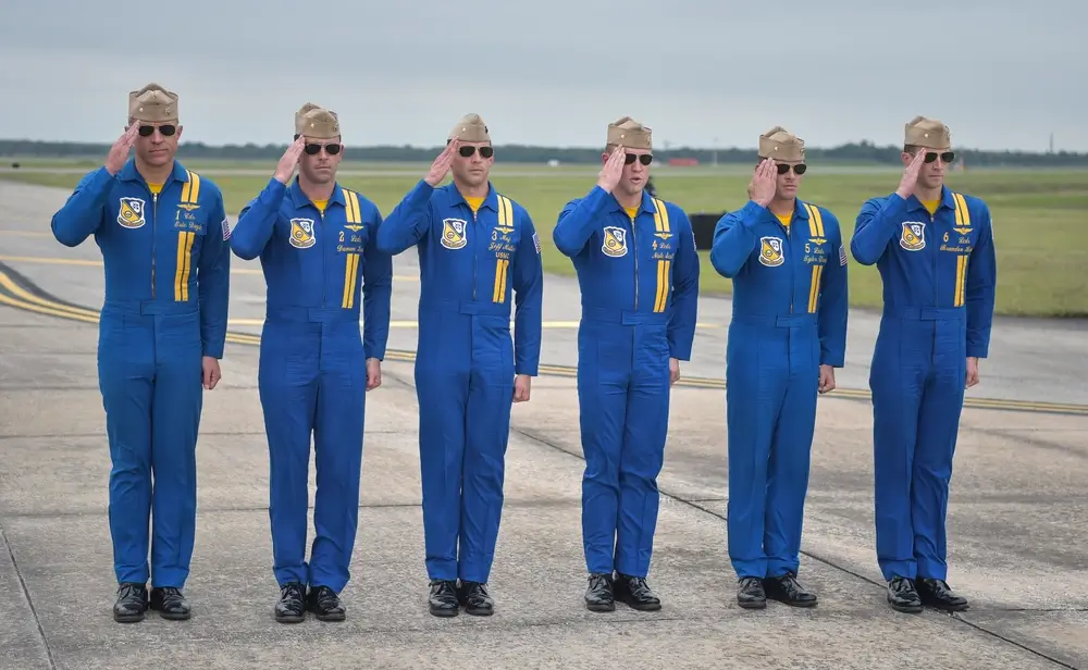 Blue Angels performing a tight formation maneuver