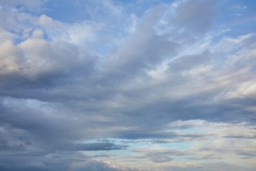 grey clouds on blue sunlight sky background